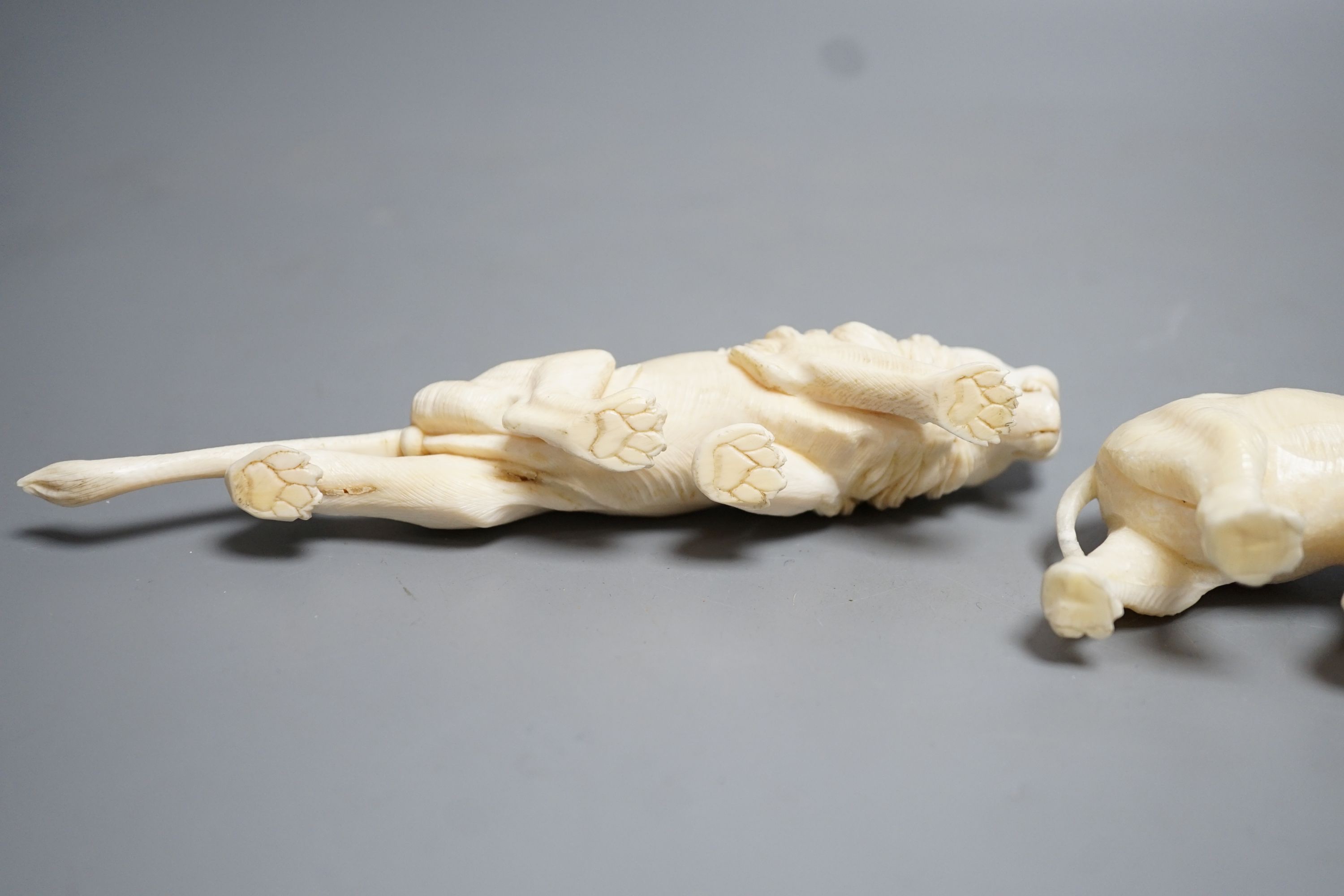 A Japanese Ivory model of an elephant and a similar Ivory model of a lion, early 20th century (2) lion 17cm long